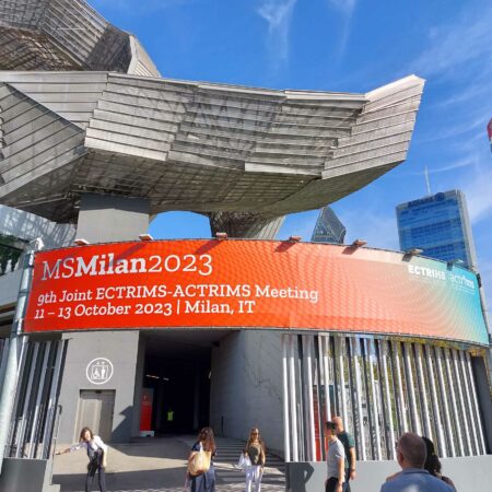 Conference venue entrance with the title of ECTRIMS 2023
